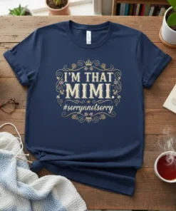 Navy t-shirt with "I'M THAT MIMI. #sorrynotsorry" text in ornate gold and pink floral border