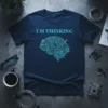 Navy blue t-shirt with "I'M THINKING" text above a glowing blue circuit board brain graphic