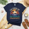 I'm Tired Up Not Being In Hawaii text with tropical sunset and palm trees graphic on navy t-shirt