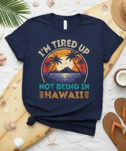 I'm Tired Up Not Being In Hawaii text with tropical sunset and palm trees graphic on navy t-shirt