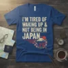 T-shirt with "I'm Tired of Waking Up Not Being in Japan" quote and Japanese scenery graphic
