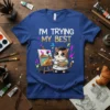 I'm Trying My Best t-shirt with a cute cartoon cat dressed as an artist painting on an easel