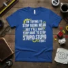 Blue t-shirt with white and yellow text: "I'm Trying To Stop Being Mean But Y'all Have To Stop Stupid Stupid
