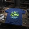 Blue t-shirt with "I'm with... ICAG" in neon yellow, surrounded by gears and circuit board graphics, featuring a heartbeat line