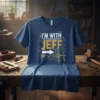 Blue t-shirt with white and gold text "I'M WITH JEFF" and a compass graphic