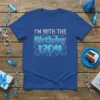 Blue t-shirt with "I'M WITH THE Birthday BOY" text in silver and blue gradient, surrounded by confetti and gift graphics