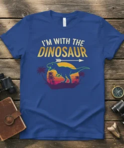 Retro "I'm With The Dinosaur" t-shirt design featuring a T-Rex silhouette, palm trees, and a sunset graphic