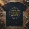 I'm With The Witch t-shirt featuring gold and black text with witchy graphics like hats, brooms, and potions