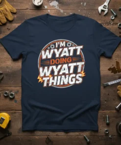 Navy t-shirt with white and orange text reading "I'M WYATT DOING WYATT THINGS" in a circular graphic