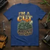 T-shirt design with text "I'm A Cut Above The Rest" featuring a man mowing grass and emitting smoke