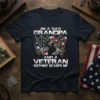 I'm a Dad Grandpa and a Veteran Nothing Scares Me quote on a navy t-shirt with American flag and military