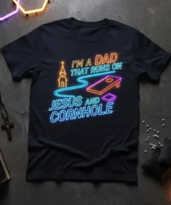 Neon style graphic t-shirt with text "I'm a Dad That Runs On Jesus And Cornhole", featuring a church and cornhole