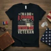 I'm A Dad A Grandpa And A Vietnam War Veteran text design on a black t-shirt with American flag graphic