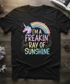 Black t-shirt with "I'm A Freakin' Ray Of Sunshine" text, a unicorn, and a rainbow graphic