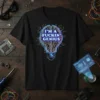 I'M A FUCKIN' GENIUS quote on a black t-shirt with a blue and purple glowing brain lightbulb circuit board design