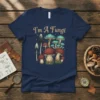 I'm A Fungi t-shirt design with vintage-style mushrooms and whimsical text in gold, featuring red and teal fungi