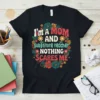 Retro floral wreath design on a black t-shirt that reads "I'm A MOM AND substitute teacher NOTHING SCARES ME"