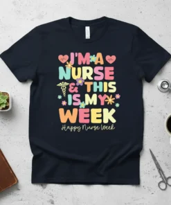 I'm A Nurse & This Is My Week quote with colorful letters and medical symbols on a navy t-shirt