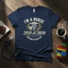 I'm a Nurse And A Mom Nothing Scares Me text with caduceus and heart graphic on a navy blue t-shirt