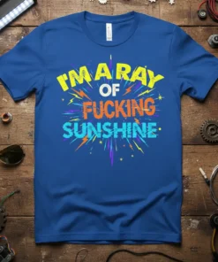 I'm A Ray Of Fucking Sunshine bold typography graphic t-shirt design in yellow, orange, and blue with lightning bolt accents