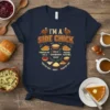 Navy blue t-shirt with "I'm a Side Chick" text and illustrations of Thanksgiving side dishes like pumpkin pie, rolls, mashed