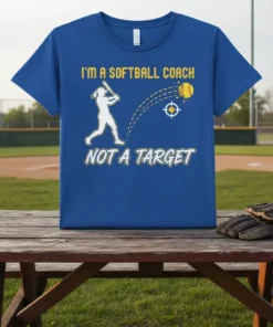 T-shirt with "I'm a Softball Coach Not a Target" text, featuring a female batter graphic and softball