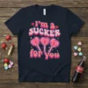 I'm a Sucker for You Valentine's Day t-shirt with retro heart lollipops and pink text