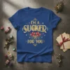 I'm a Sucker For You text with heart lollipops graphic on a blue t-shirt