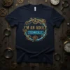 I'M AN ADULT TECHNICALLY quote on a navy t-shirt with steampunk gear graphics and neon blue accents