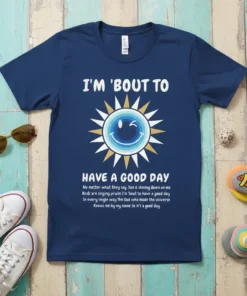 Navy blue t-shirt with "I'm 'Bout to Have a Good Day" quote, a winking sun graphic, and inspirational text about