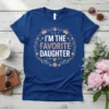 I'm The Favorite Daughter quote on a navy blue t-shirt, surrounded by a floral wreath and crowns