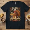 I'm The Grandma Turkey text with a cute turkey character holding a pie, surrounded by autumn leaves and cookies