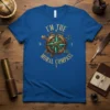 I'm The Moral Compass quote in golden typography on a blue t-shirt, featuring a steampunk-inspired compass graphic