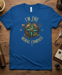 I'm The Moral Compass quote in golden typography on a blue t-shirt, featuring a steampunk-inspired compass graphic