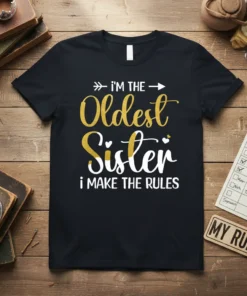 Black t-shirt with white and gold glitter text: "i'm THE Oldest Sister i MAKE THE RULES"
