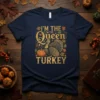 I'm The Queen Turkey Thanksgiving t-shirt design featuring a regal turkey, crown, pumpkin, and autumn leaves