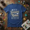 I'm The Youngest The Rules Don't Apply To Me quote on a blue t-shirt, featuring decorative borders and arrows