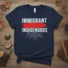Immigrant Indigenous t-shirt with white text and a red brush stroke, featuring indigenous feather graphics