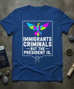 Blue t-shirt with geometric colorful bird graphic and white text: "IMMIGRANTS CRIMINALS BUT THE PRESIDENT IS."