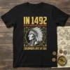 T-shirt design with text "IN 1492 NATIVE AMERICANS DISCOVERED COLUMBUS LOST AT SEA" and a portrait of a Native American