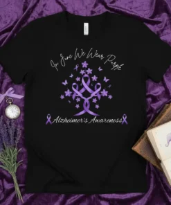 Black t-shirt with "In June We Wear Purple" text, a tree graphic with purple ribbons and butterflies, and "Alzheimer's Awareness"