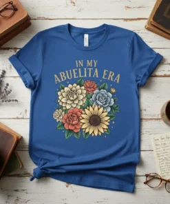 In My Abuelita Era text with a colorful bouquet of flowers on a royal blue t-shirt, floral graphic design