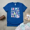 In My Adoption Day! Era t-shirt with a retro font and a cute unicorn on clouds