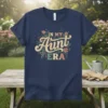 Retro floral "In My Aunt Era" text design on a navy blue t-shirt, perfect for aunts