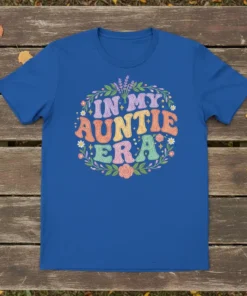 In My Auntie Era text design with floral wreath on a royal blue t-shirt