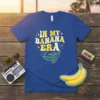 In My Banana Era text with retro graphics and a stylized banana on a blue t-shirt