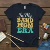 In My Band Mom ERA text with musical treble clef graphic on a dark t-shirt