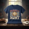T-shirt with "in my BASEBALL AUNT era" text and baseball graphic, checkerboard pattern background