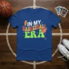 Retro "In My Basketball Era" graphic t-shirt with bold, colorful lettering and a basketball illustration