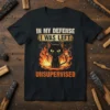 Black cat surrounded by flames with text "In My Defense I Was Left Unsupervised" on a t-shirt